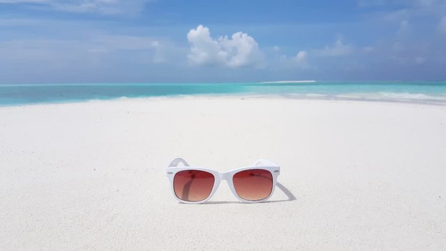 Sunglasses on a tropical beach in Asia