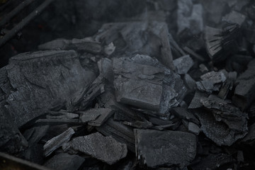 Grilled black coal close-up