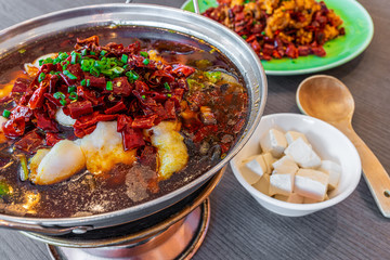 Asia, China food. Szechuan water boiled spicy fresh fish. Fried Chicken side dish. Chengdu Chongqing hotpot food culinary.