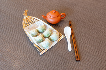 Fototapeta na wymiar Cantonese Dim Sum food cuisine. Steamed Chinese Dumplings.