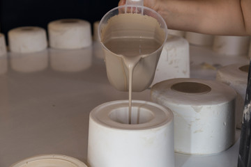 ceramic cast ,molds for cup on the table in the workshop.