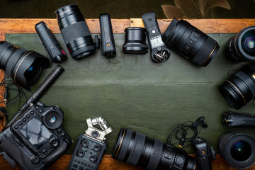 Photography and Audio Recording Equipment, Top-down-view on vintage wooden table.