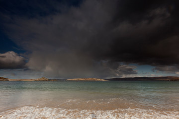 Dark rain clouds over Melness beach