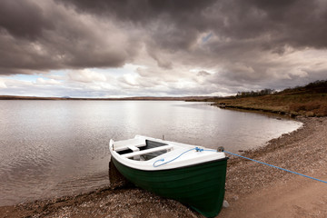Fototapeta na wymiar A lovely boat on the shore of Loch Loyal