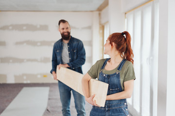 Young couple doing DIY carpentry at home