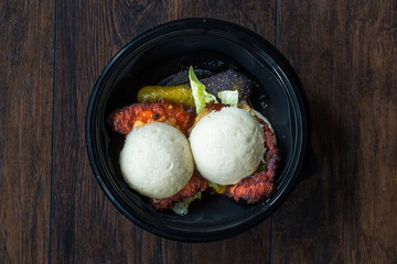 Take Away Gua Bao Burger with Crispy Chicken and Red Hot Chili and Relish Sauce Buns in Plastic Plate Box Container / Package.