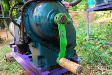old model electricity generator Powered by oil at Indian Village for power supply in any occasion ceremony, which is started by turning the handle to generate electricity