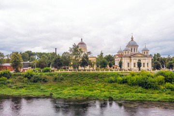 Fototapeta na wymiar The Savior-Transfiguration Cathedral at the embankment of Tvertsa river in Torzhok, Russia.