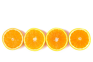 Four orange halves on a white isolated background.