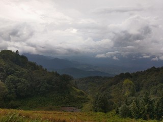 Naklejka premium landscape with mountains and clouds