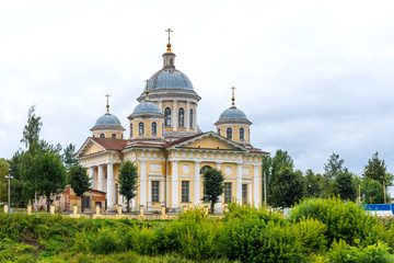 Fototapeta na wymiar The Savior-Transfiguration Cathedral at the embankment of Tvertsa river in Torzhok, Russia.
