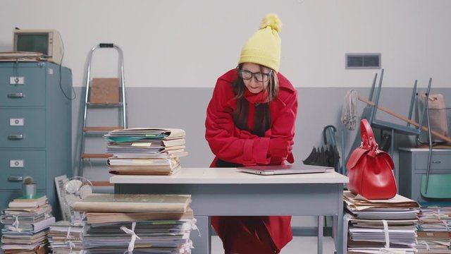 Woman arriving in a cold office at winter