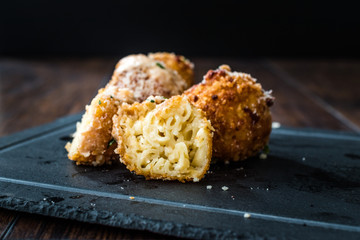 Half Cut Fried Mac and Cheese Balls with Parmesan Cheese / Macaroni Bites.