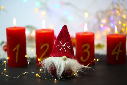 gnom with 4 candles on a red background