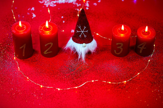 gnom with 4 candles on a red background