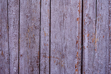Vintage wood background with peeling paint, purple color