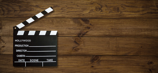 Movie clapper board on wooden background