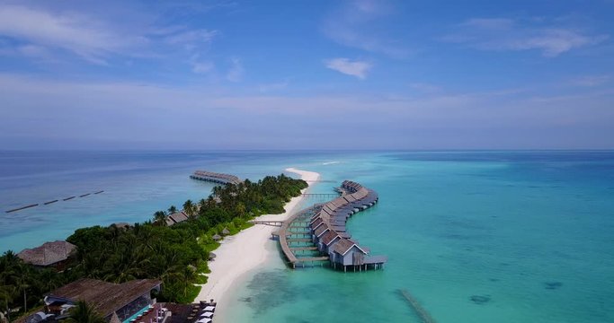 Bungalows Over Calm Emerald Water Of Lagoon Near Shore In Philippine sea