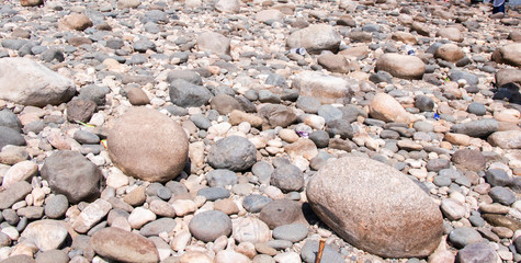 Stone on the lake after waterfall