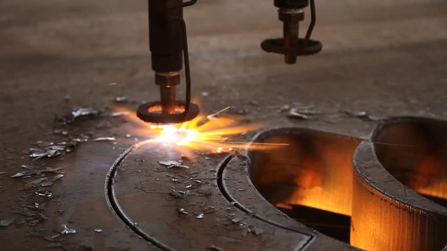 laser cutting metal sheet with sparks