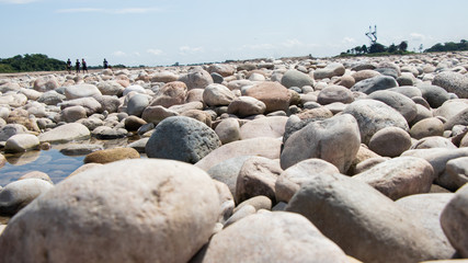 Stone on the lake after waterfall
