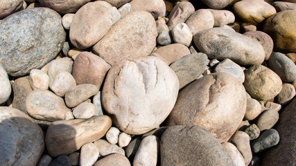 Stone on the lake after waterfall