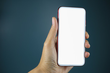 Hand holding the black smartphone with white blank screen isolated.