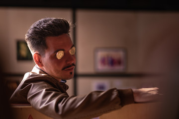 young man with bitcoins in the eye sockets. financier. business meeting