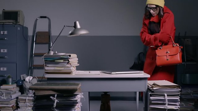 Woman arriving in the cold office early in the morning