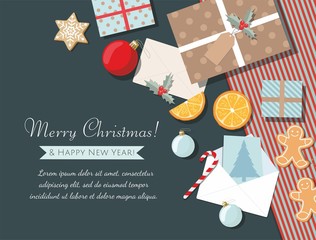 Holiday christmas background with gifts, cookies, greeting card and christmas ball. Top view.  - 297994869