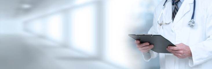 Doctor holding a clipboard; panoramic banner