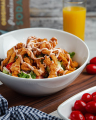 chicken salad with vegetables on the table