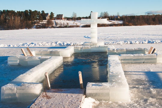 winter baptismal font on lake