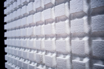 A sheet of packaging foam with a square pattern. 