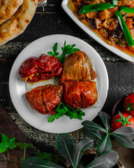 stuffed tomatoes and peppers on the table
