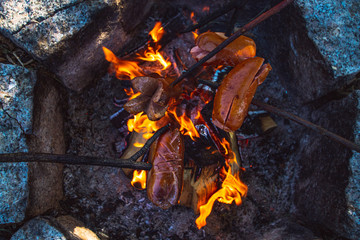 grilling sausages on fire