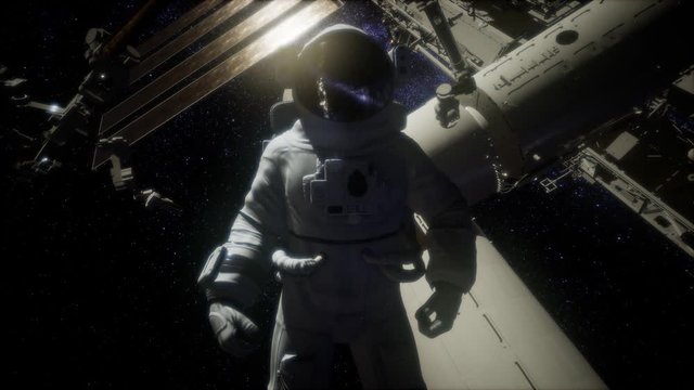 Astronaut outside the International Space Station on a spacewalk. Elements of this image furnished by NASA