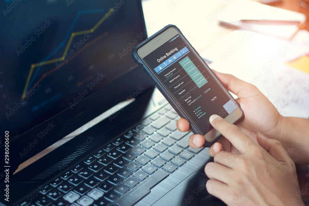 Leinwandbilder Businessman using mobile smartphone with data information banking network connection on screen, mobile banking and online payment.