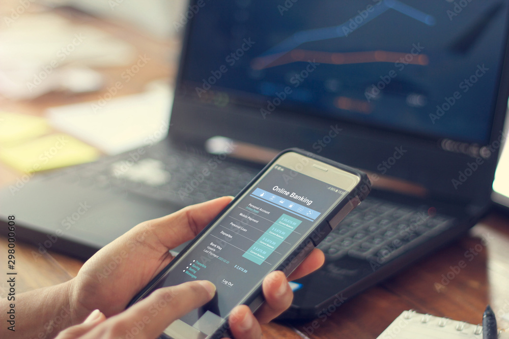 Leinwandbilder Businessman using mobile smartphone with data information banking network connection on screen, mobile banking and online payment.