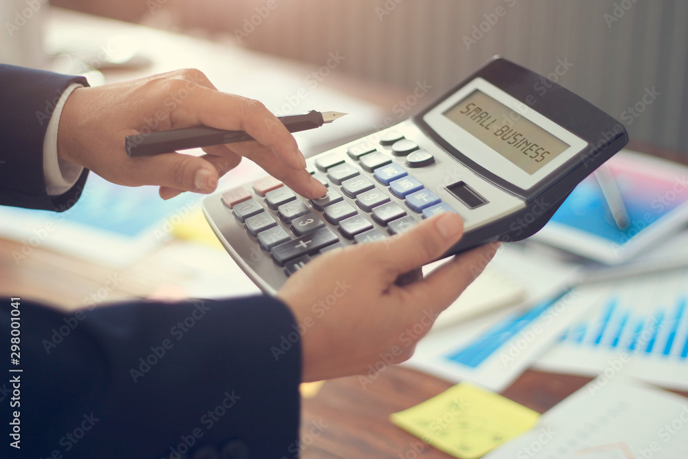 Poster business financing accounting banking and word small business displayed on calculator on graph growt