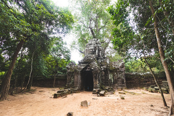 Gate to the temple with the head of the deity in the temple complex of Angkor