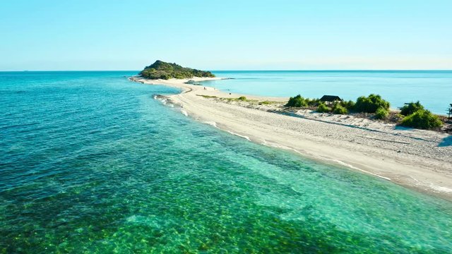 Truly amazing tropical island in the middle of the ocean. Aerial view of an island with white sand beaches and beautiful lagoons