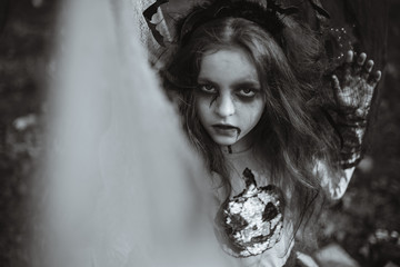 Close up of a bad zombie girl, halloween costume.