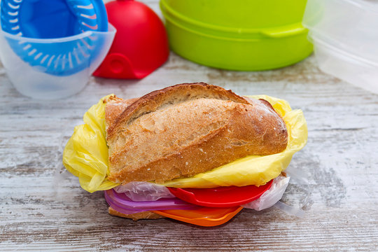 A metaphoric image of a sandwich filled with plastic food