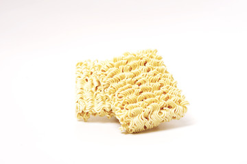 Two stacked dry instant noodle isolated in white background