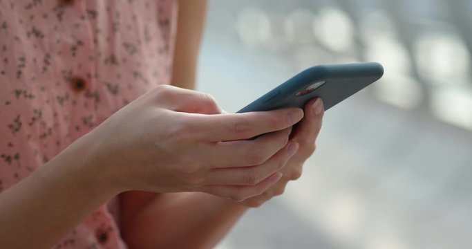 Close up of woman use of smart phone at outdoor