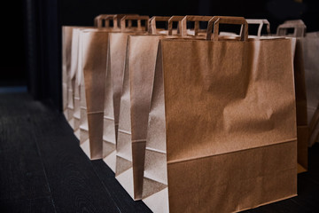 Kraft paper bags stand in a row