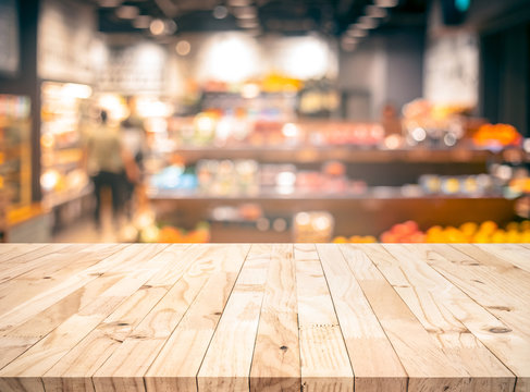 Wood texture table top (counter bar) with blur grocery,market store background