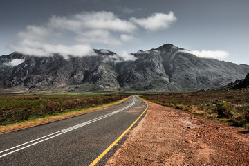 Road leading to majestic mountain range