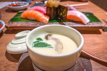 Steamed egg, sushi urchin, salmon, scallop sushi in Japanese restaurant